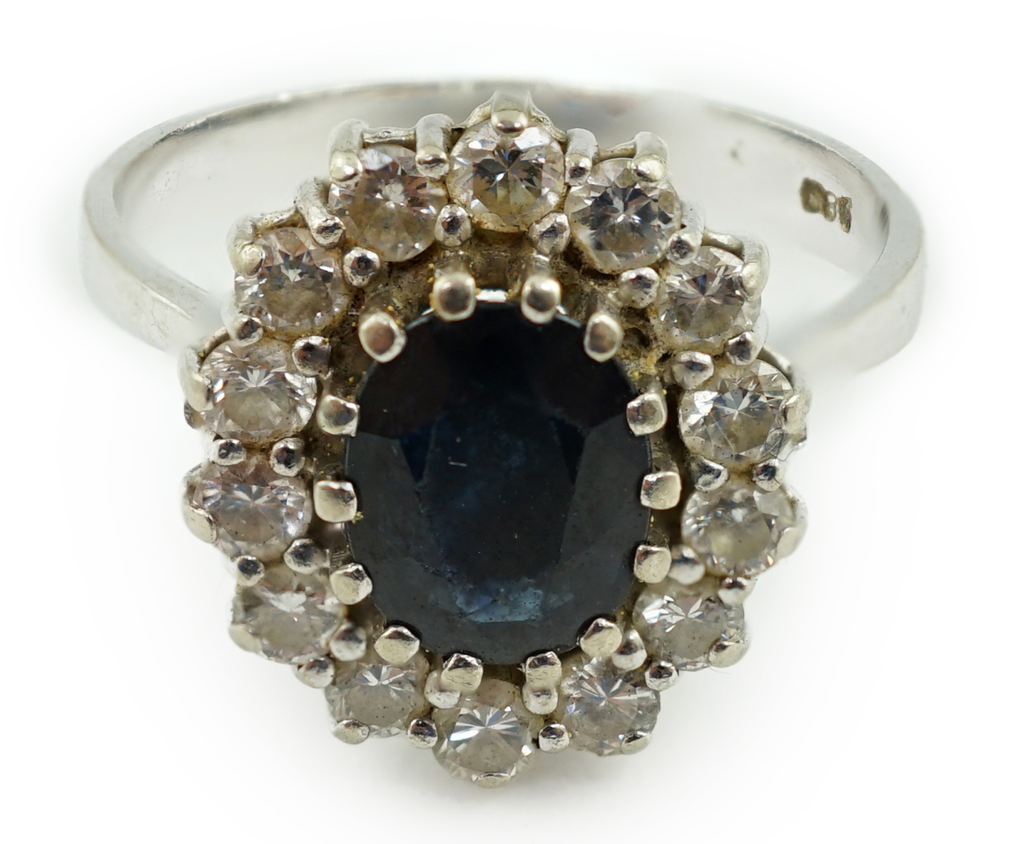 A mid to late 20th century 14k white gold, sapphire and diamond set oval cluster ring